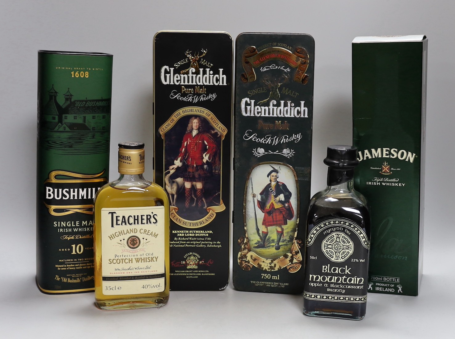 6 bottles of whisky/whiskey and brandy - 2 70cl bottles of Glenfiddich, 1 70cl bottle of Bushmills, a 70cl bottle of Jameson, a 50cl bottle of Black Mountain apple and blackcurrant brandy and a 35cl bottle of Teachers